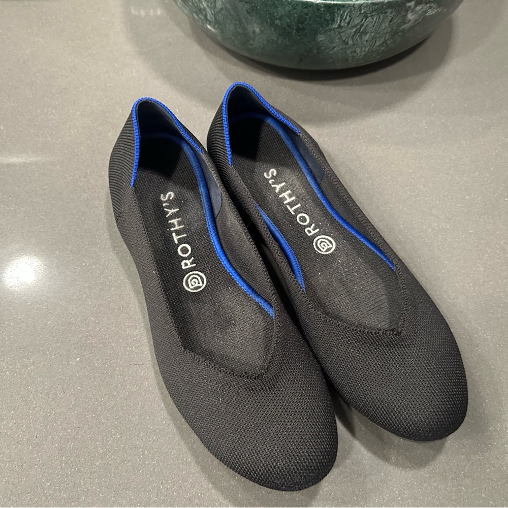 Rothy's Elegant Black Flats with Blue Accents